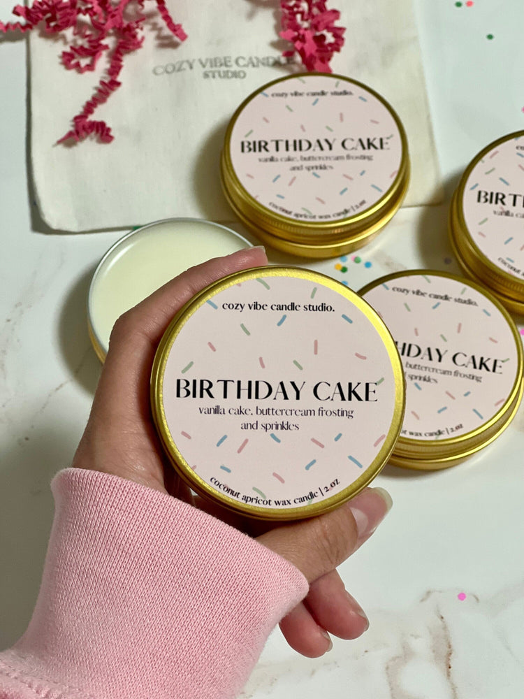 mini 2 ounce birthday candle in gold tin with wooden wick and biodegradable glitter