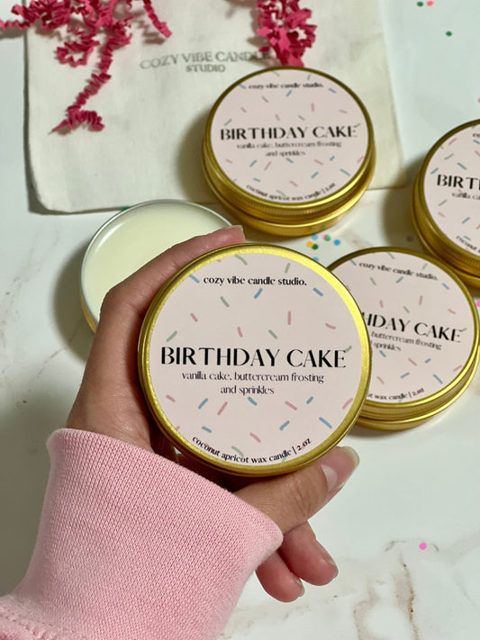mini 2 ounce birthday candle in gold tin with wooden wick and biodegradable glitter 